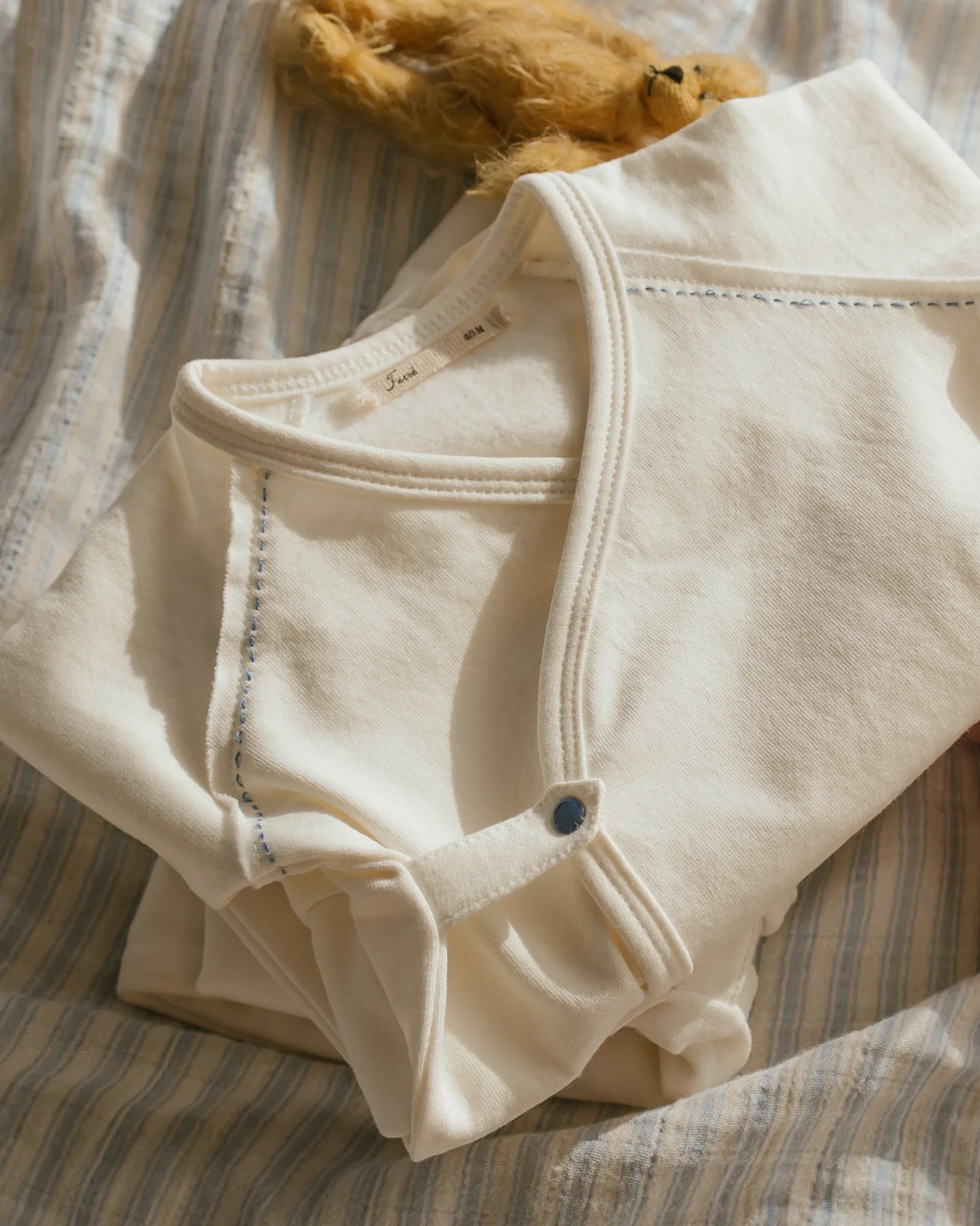 Flap footie-Milk w blue stitching