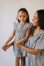 Load image into Gallery viewer, mom and girl wearing matching check mate dresses
