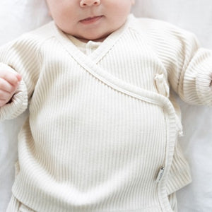 Ribbed jersey top for babies with fabric tie