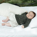 Load image into Gallery viewer, Sleeping baby in white shorts &amp; green top
